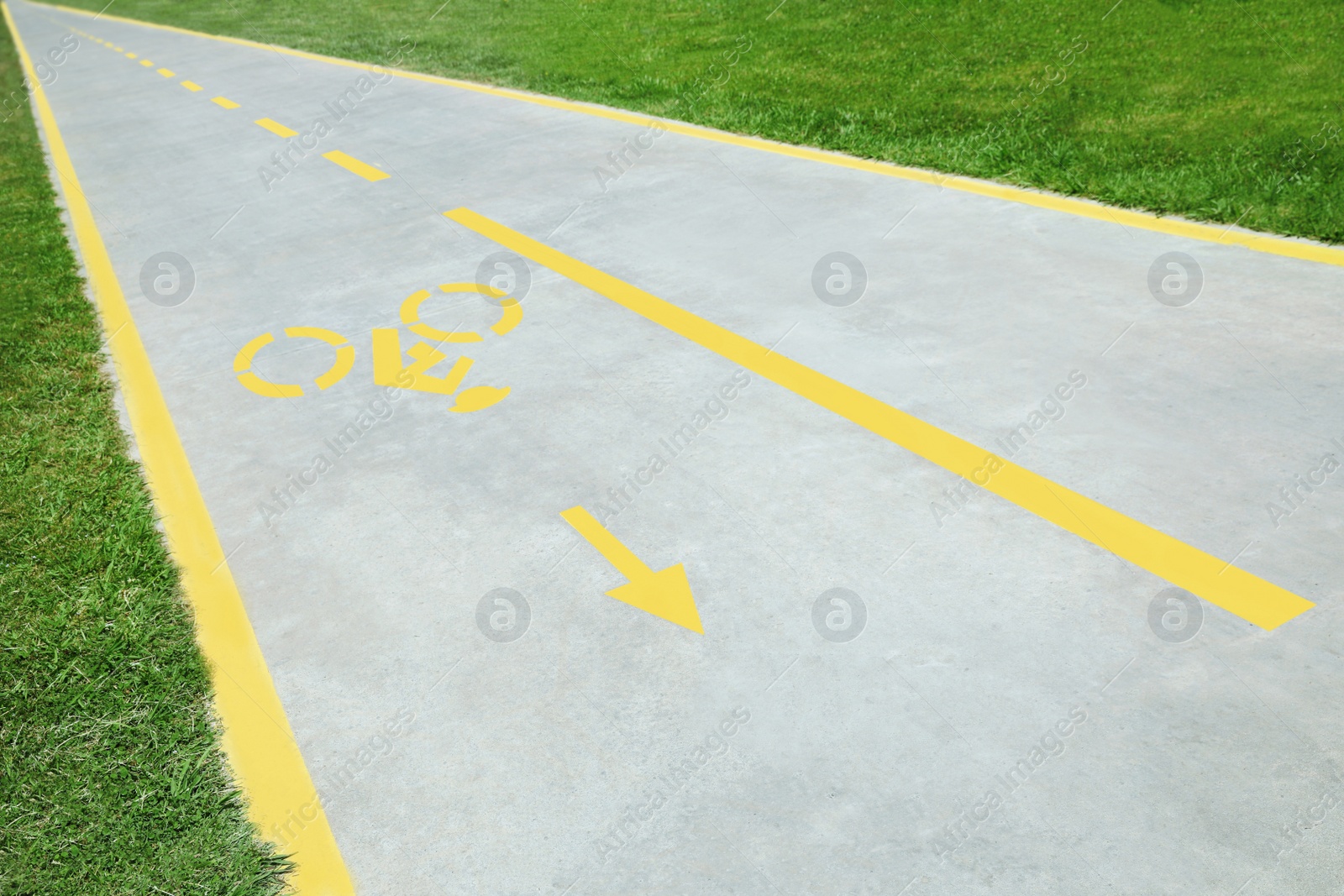 Photo of Bike lane with painted yellow bicycle sign and arrow