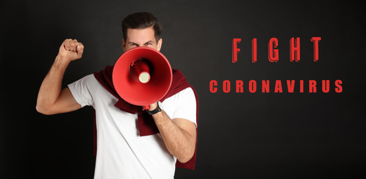 Handsome man with megaphone on black background. Fighting with coronavirus