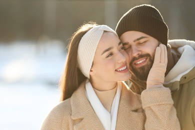 Photo of Beautiful young couple enjoying winter day outdoors