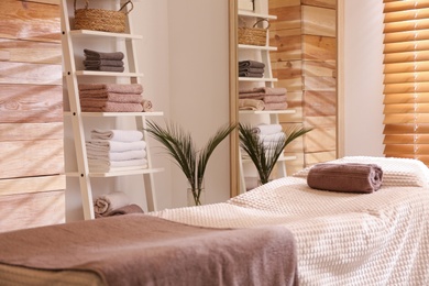 Stylish massage room interior in spa salon