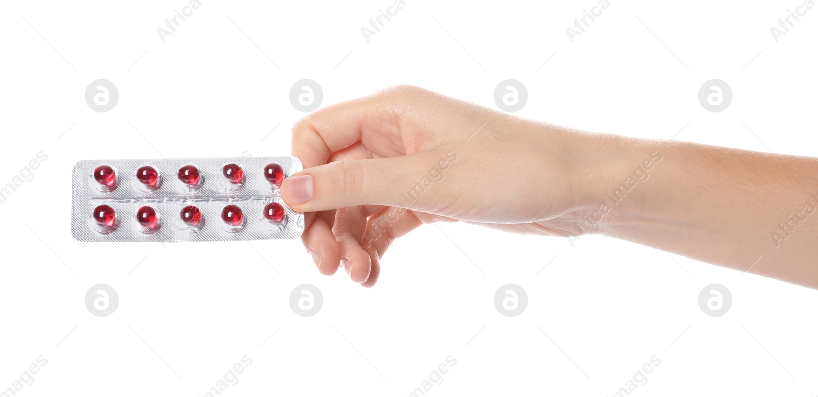 Photo of Woman holding pills in blister pack on white background, closeup