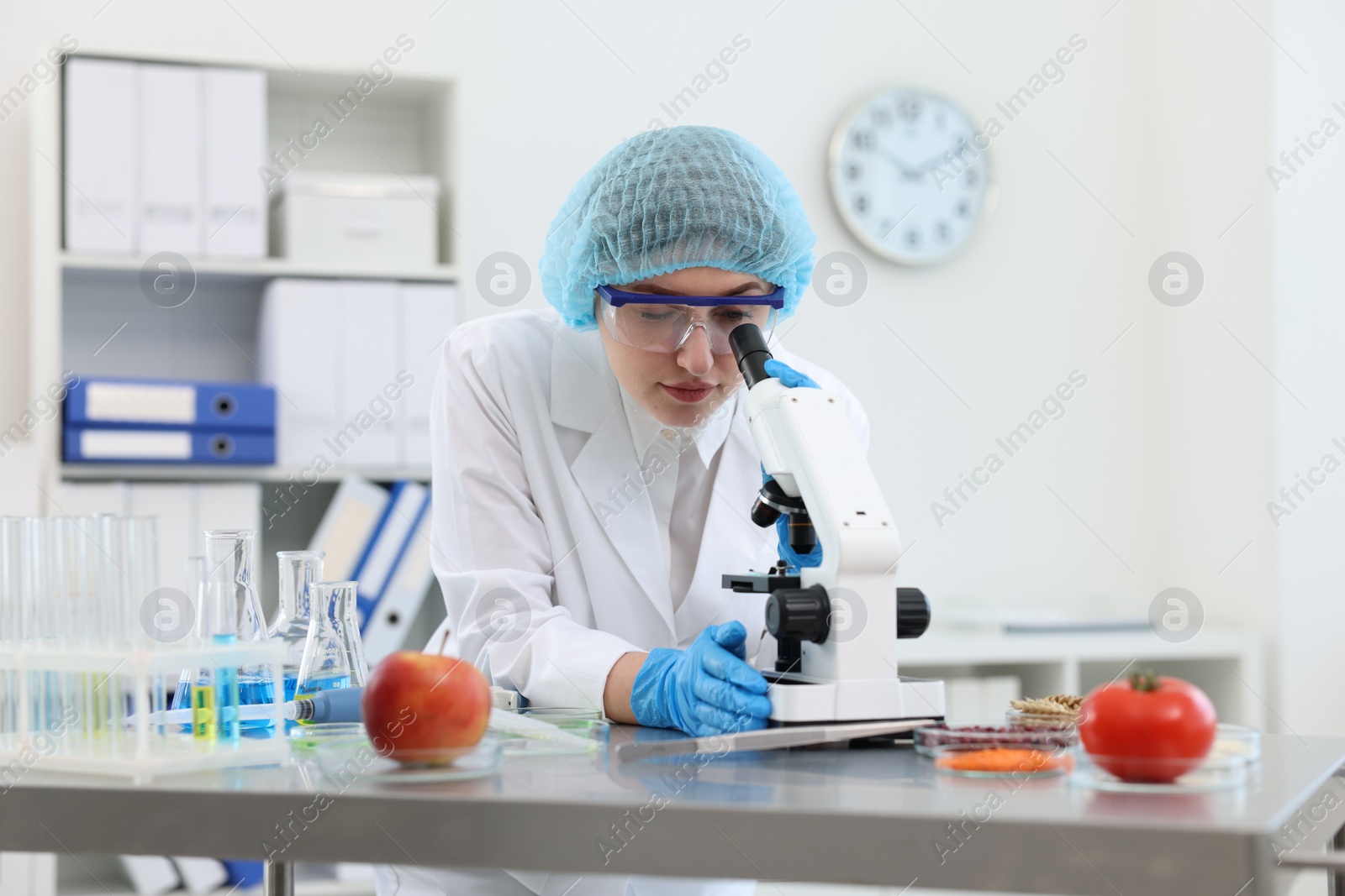 Photo of Quality control. Food inspector checking safety of products in laboratory