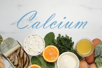 Image of Different fresh products with high amounts of easily absorbable calcium on white marble table, flat lay