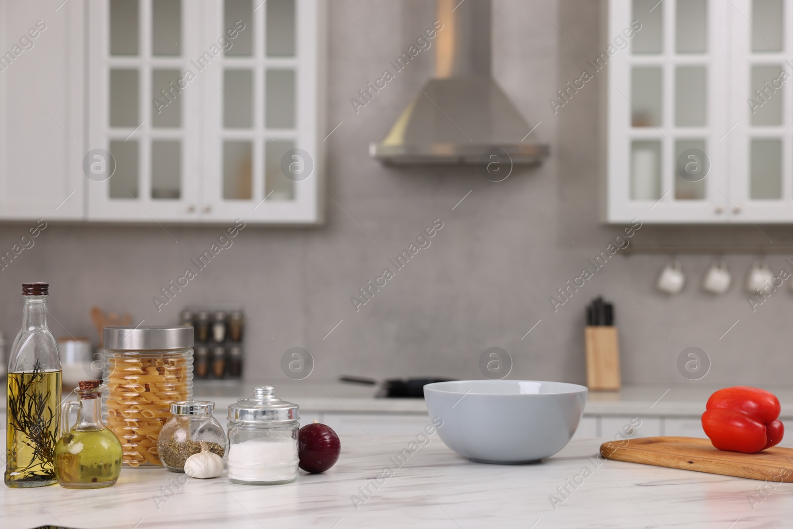 Photo of Many different products on white marble countertop in kitchen