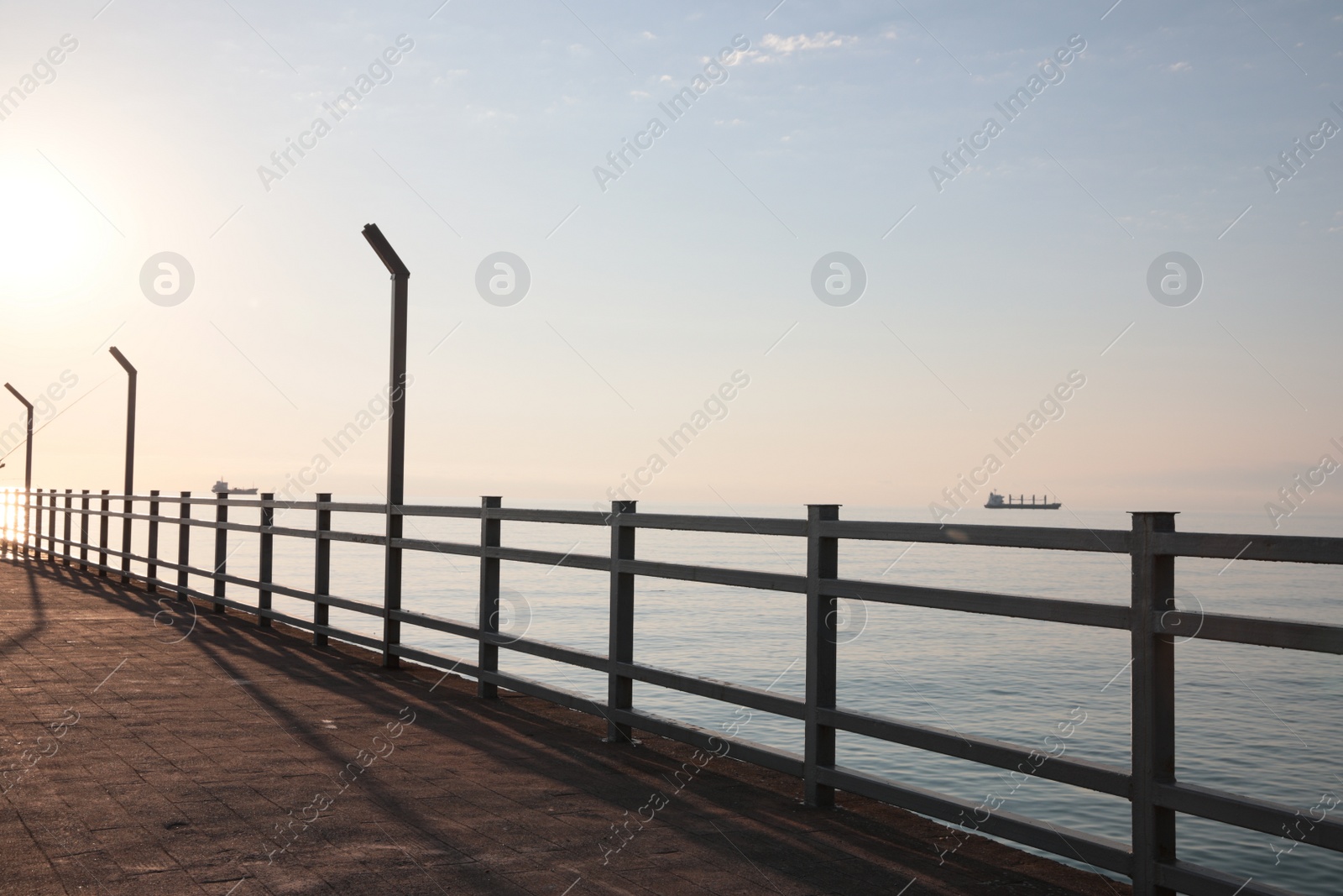 Photo of Picturesque view of pier near sea on sunny day