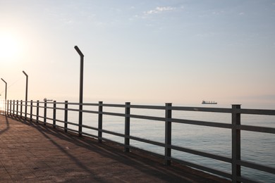 Photo of Picturesque view of pier near sea on sunny day