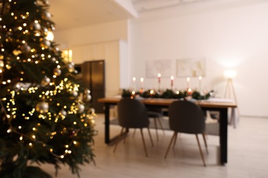 Photo of Blurred view of cozy kitchen decorated for Christmas. Interior design