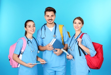 Photo of Group of young medical students on color background