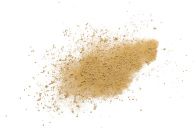 Photo of Pile of brown dust scattered on white background, top view