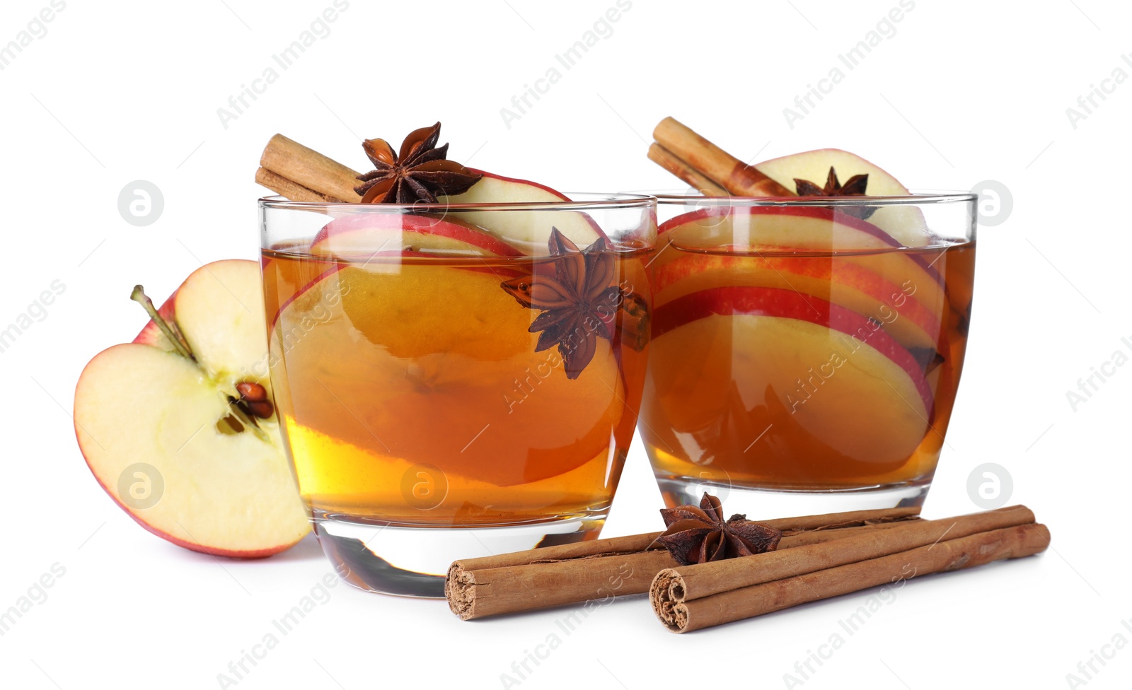 Photo of Hot mulled cider and ingredients on white background