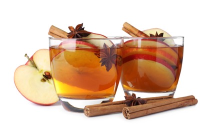 Photo of Hot mulled cider and ingredients on white background