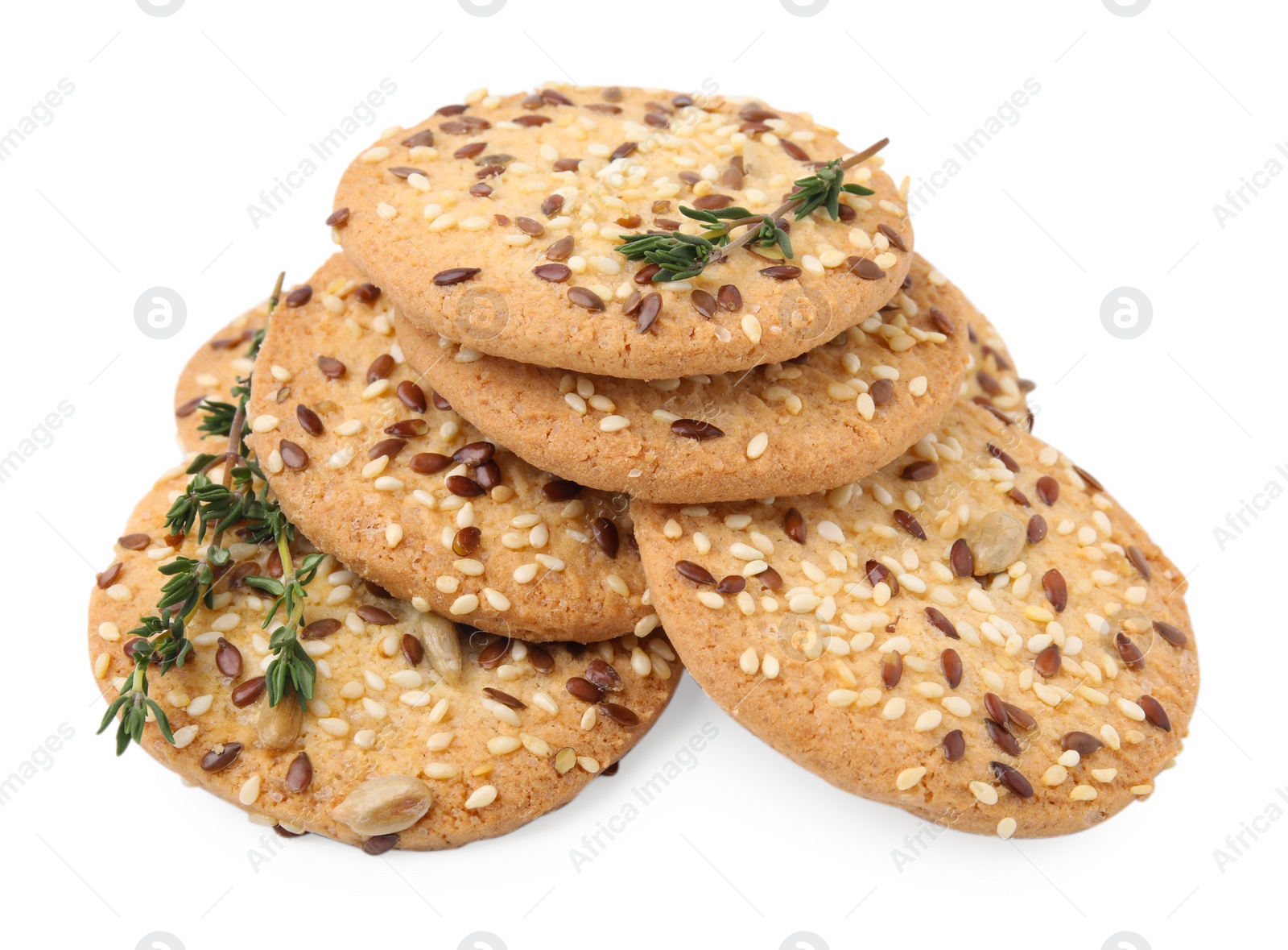 Photo of Round cereal crackers with flax, sunflower, sesame seeds and thyme isolated on white