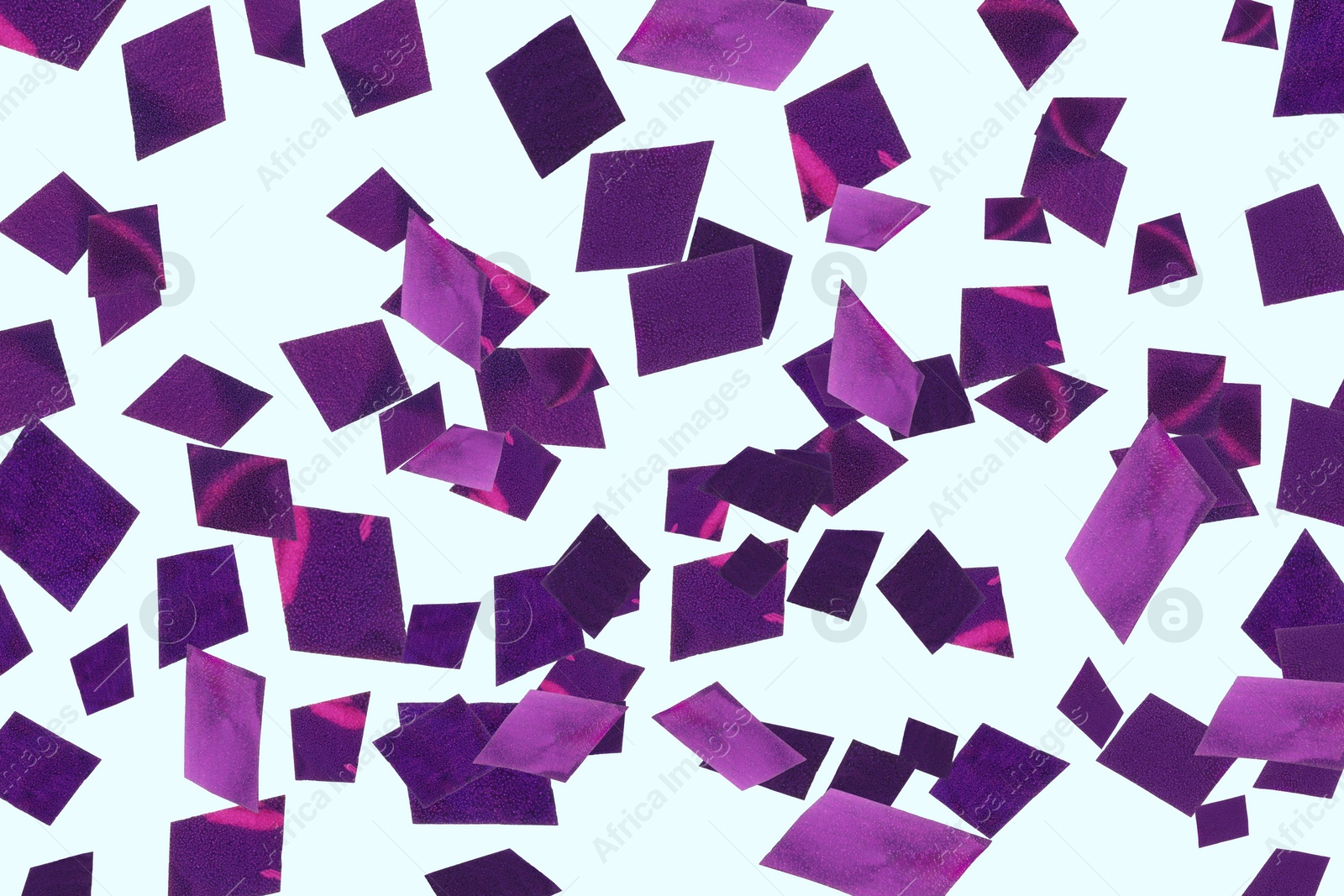 Image of Shiny purple confetti falling on light blue background