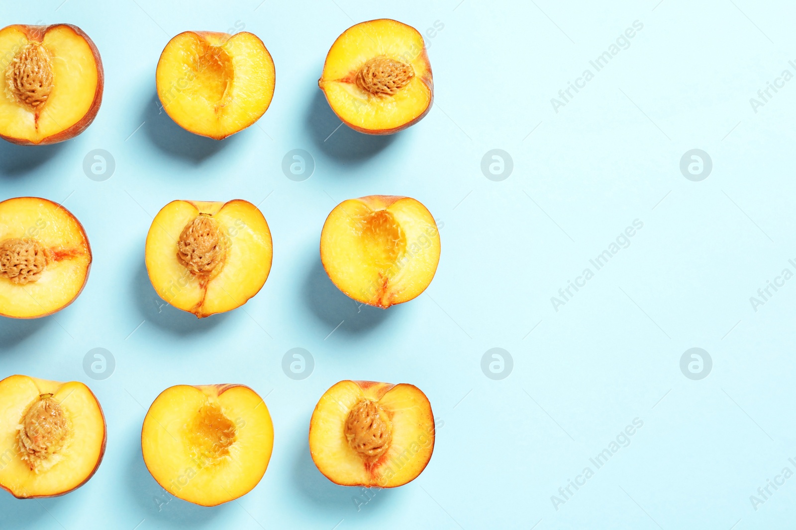 Photo of Flat lay composition with ripe peaches on color background