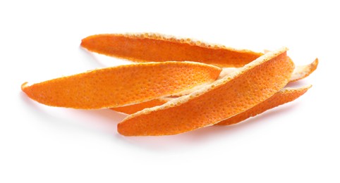 Photo of Dry orange fruit peels on white background