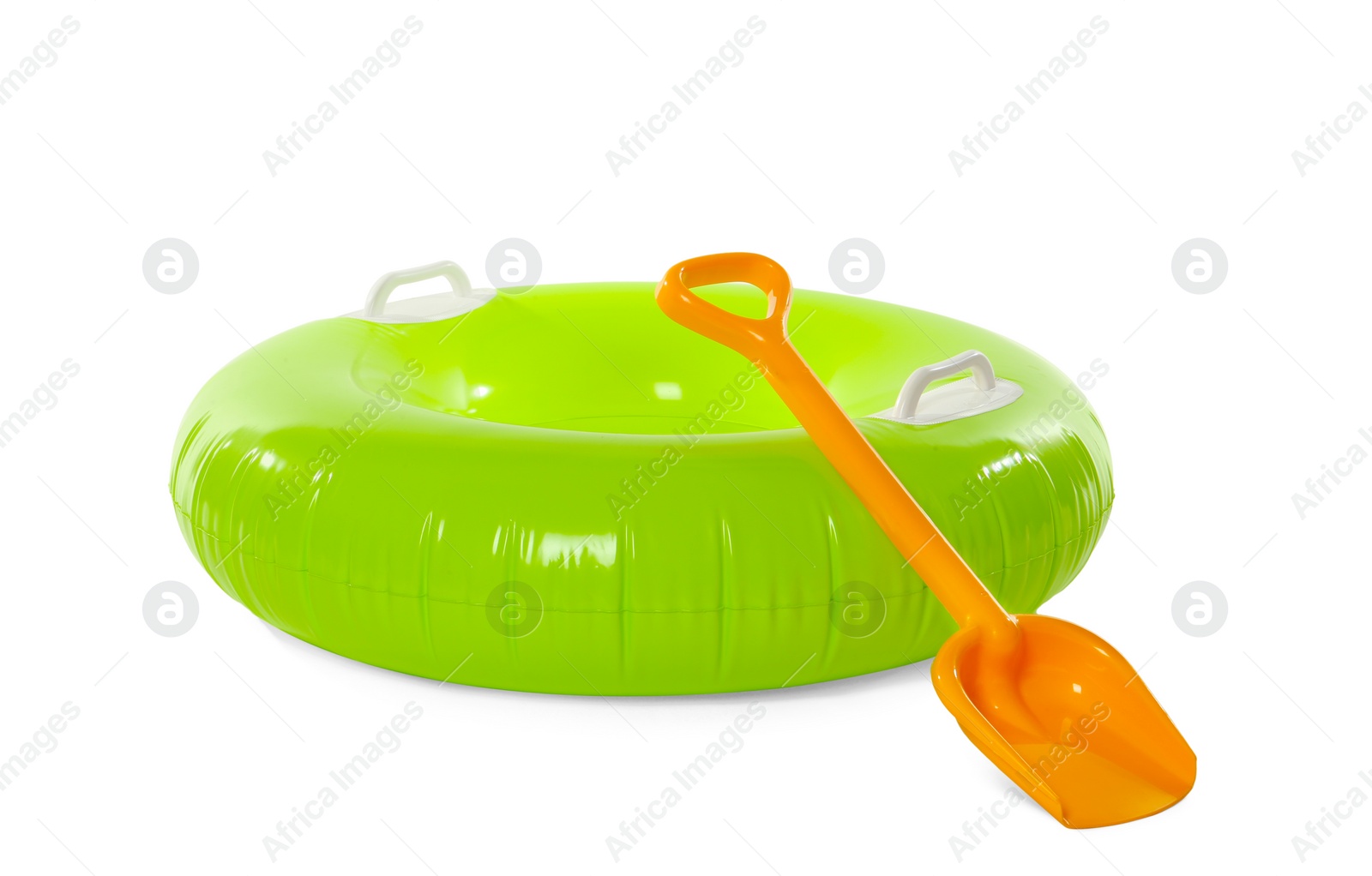 Photo of Inflatable ring and beach shovel on white background. Summer holidays