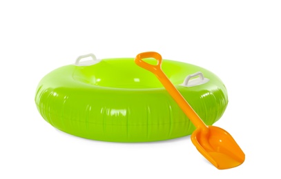 Photo of Inflatable ring and beach shovel on white background. Summer holidays