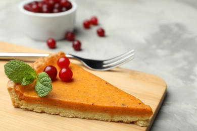 Piece of fresh homemade pumpkin pie on marble table 