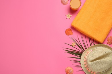 Flat lay composition with different beach objects on pink background, space for text