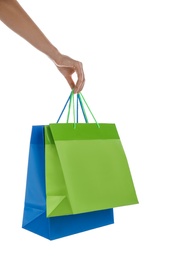 Photo of Woman with paper shopping bags on white background, closeup