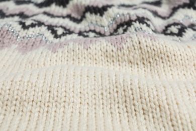 Photo of Texture of cozy warm sweater as background, closeup