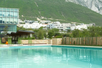 Photo of Outdoor swimming pool in inner yard of hotel