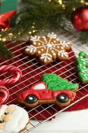 Tasty homemade Christmas cookies and decor on white table