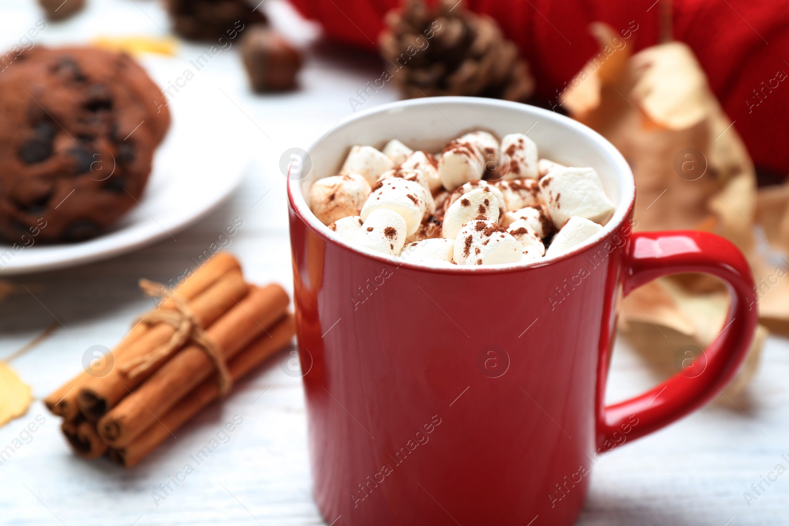 Photo of Cup of hot drink and cookies on white wooden table, closeup. Cozy autumn atmosphere