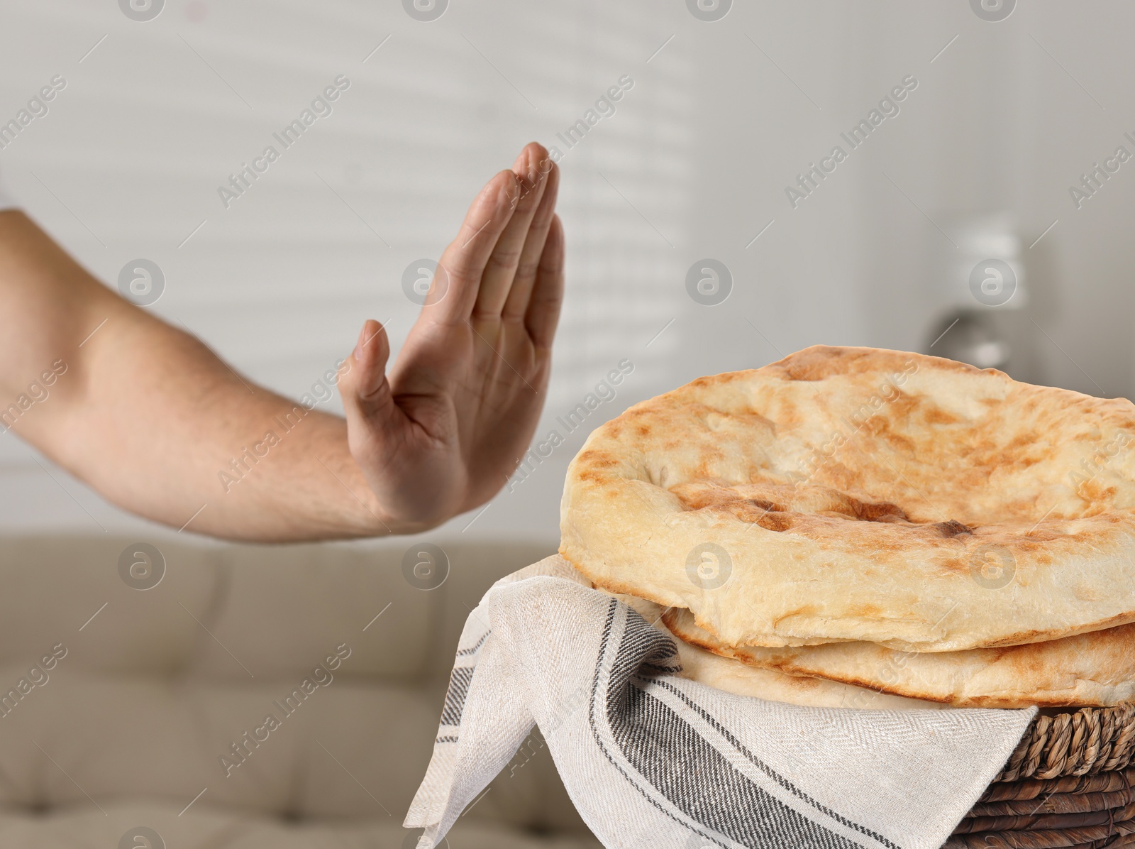 Image of Gluten free diet. Man refusing from pastry at home, closeup