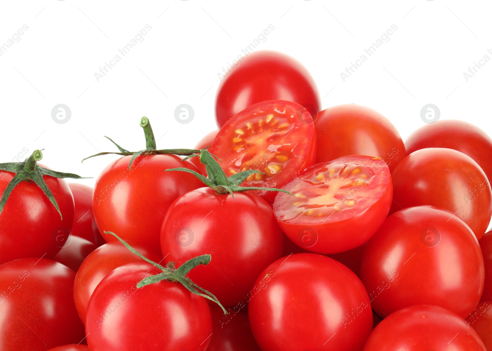 Photo of Whole and cut cherry tomatoes isolated on white, closeup