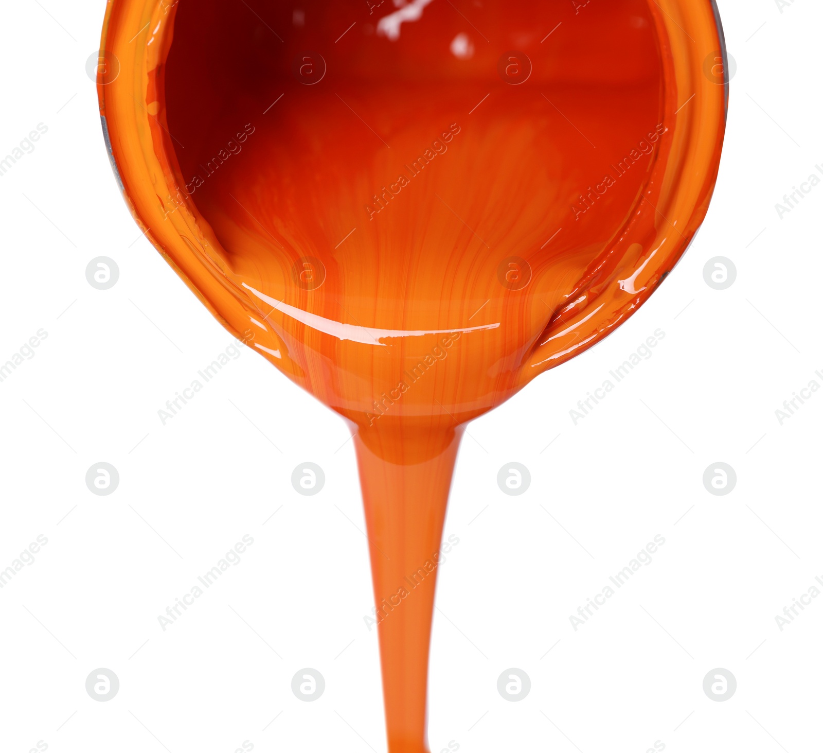 Photo of Pouring orange paint from can on white background, closeup