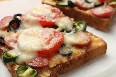 Tasty pizza toast on table, closeup view
