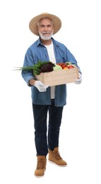 Photo of Harvesting season. Farmer holding wooden crate with vegetables on white background