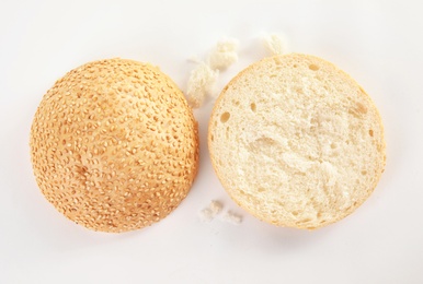 Photo of Sliced hamburger bun on white background, top view. Bread product