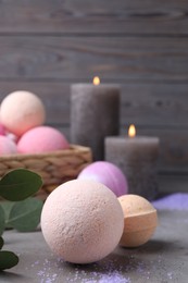 Beautiful composition with aromatic bath bombs on grey table