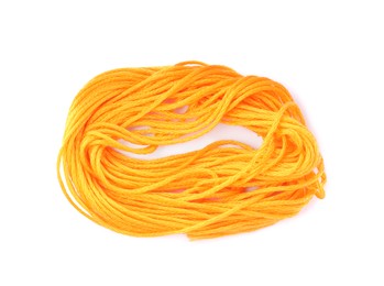 Photo of Light orange embroidery thread on white background, top view