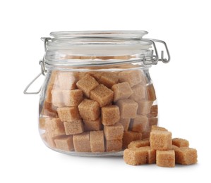 Glass jar and brown sugar cubes on white background