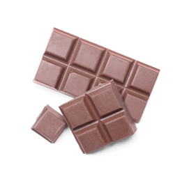 Photo of Pieces of delicious milk chocolate isolated on white, top view