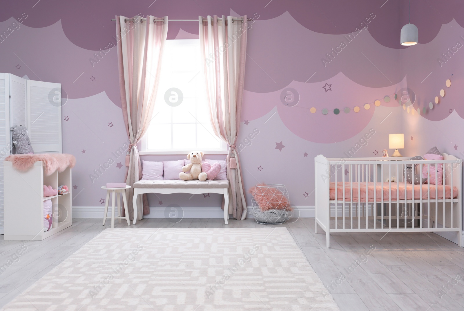 Image of Baby room interior with comfortable crib 