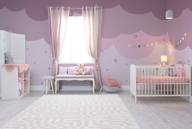 Baby room interior with comfortable crib 