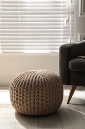 Stylish comfortable pouf in room. Home design