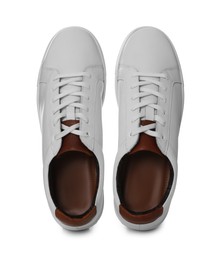 Photo of Pair of stylish sports shoes on white background