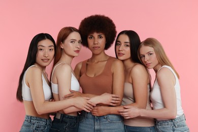 Photo of Portrait of beautiful young women on pink background