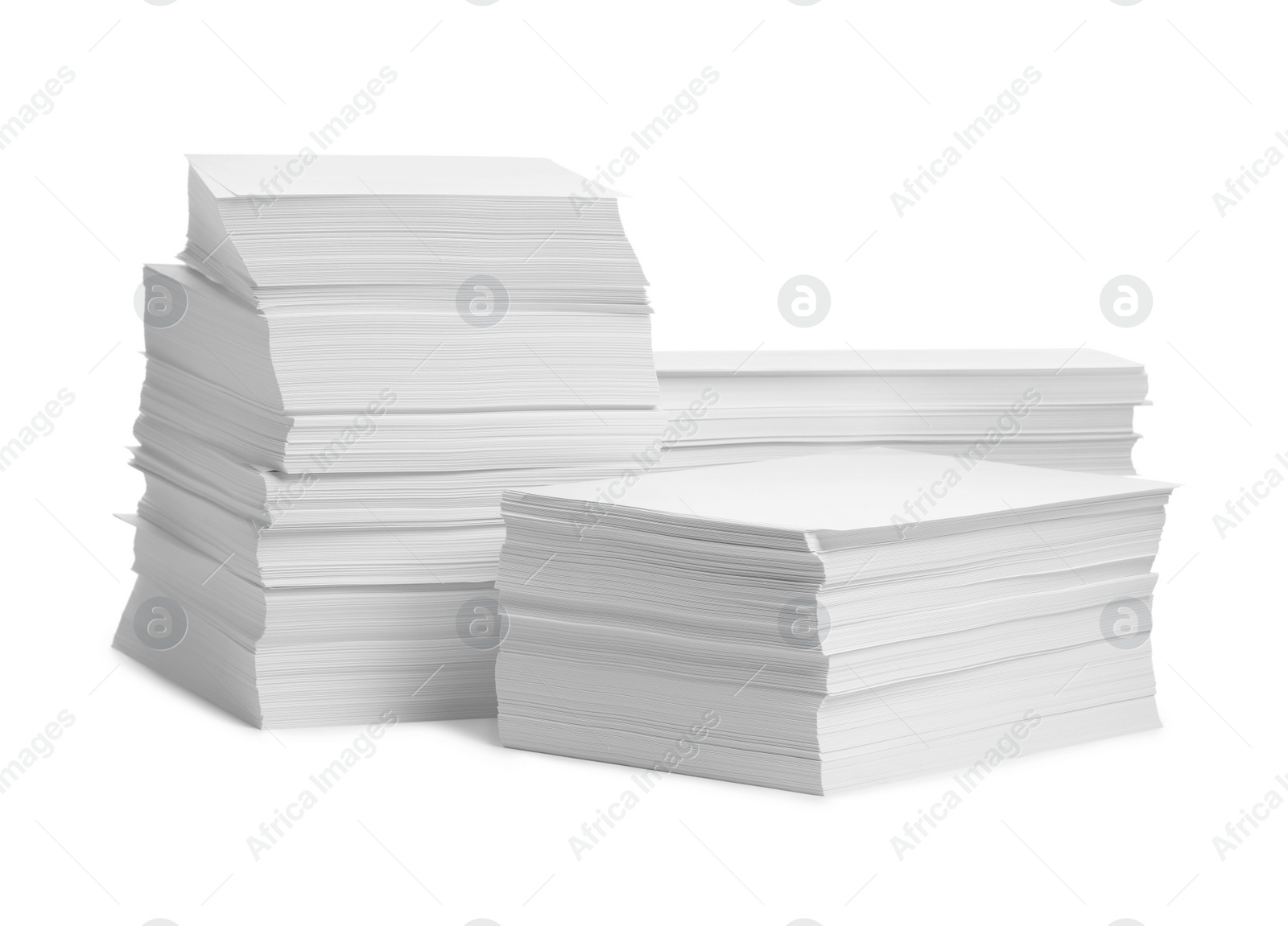 Photo of Stacks of paper sheets on white background