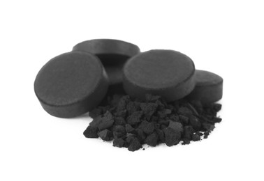 Photo of Activated charcoal on white background. Potent sorbent