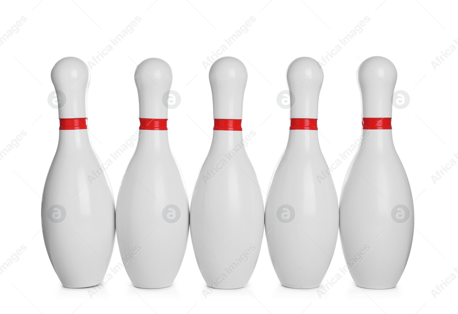 Photo of Bowling pins with red stripes isolated on white