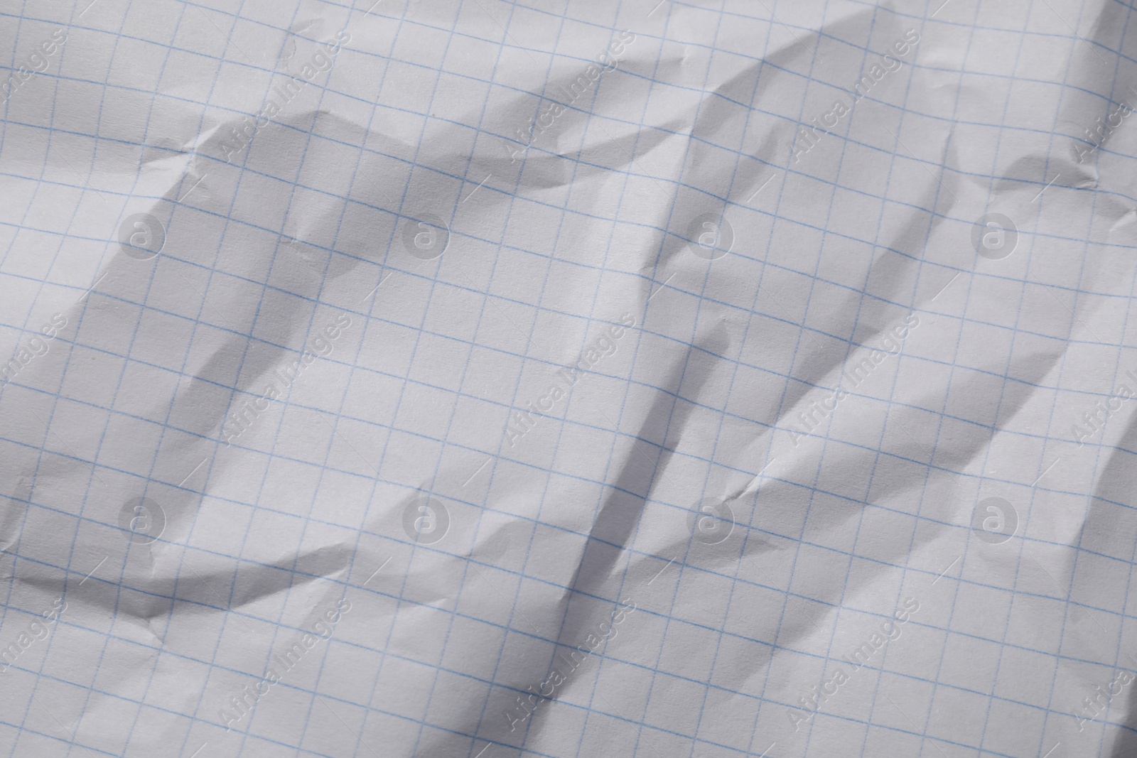 Photo of Crumpled sheet of paper as background, top view