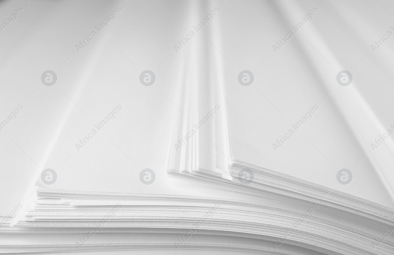 Photo of Stack of blank paper as background, closeup