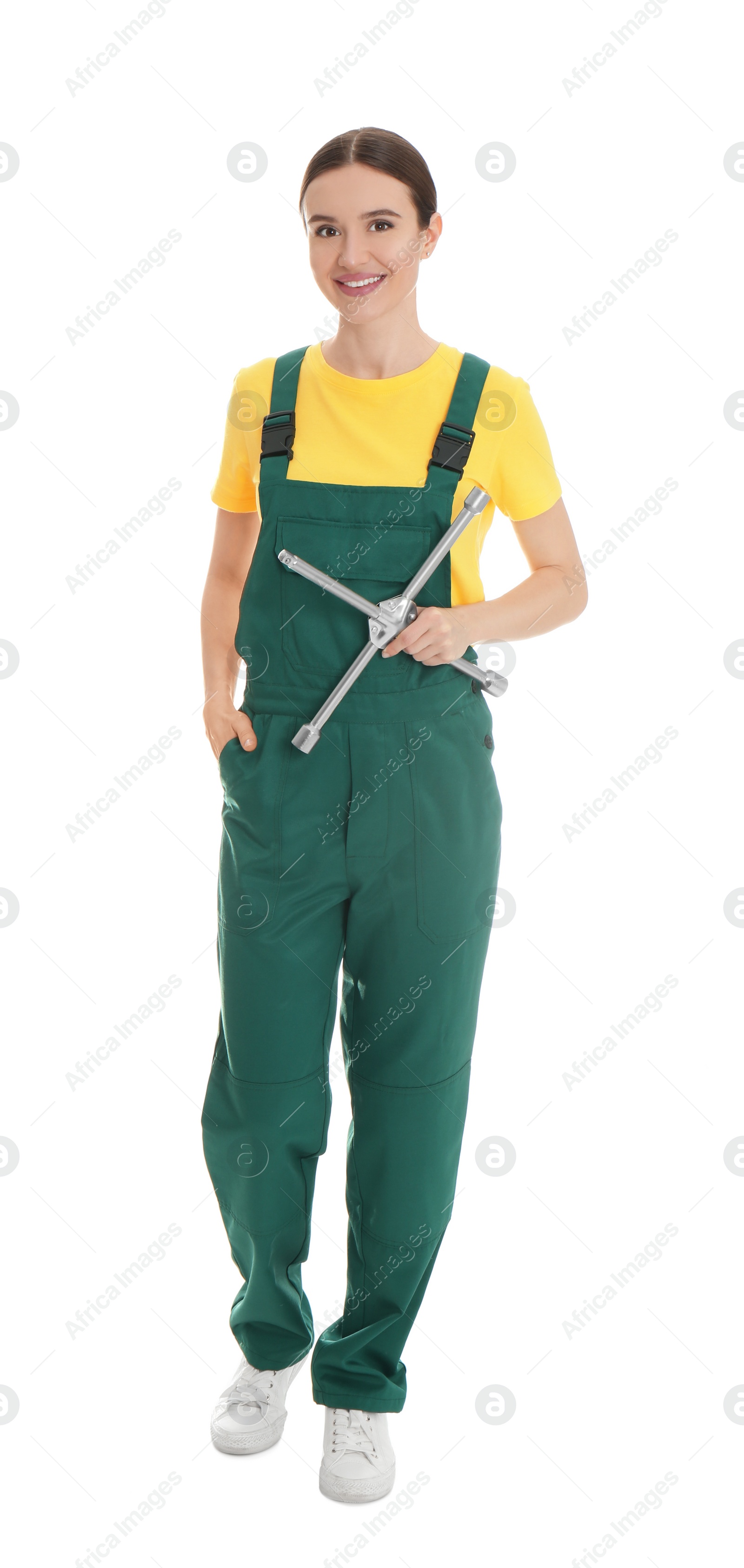 Photo of Full length portrait of professional auto mechanic with lug wrench on white background