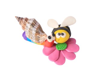 Photo of Bee with flower and snail made from plasticine on white background. Children's handmade ideas